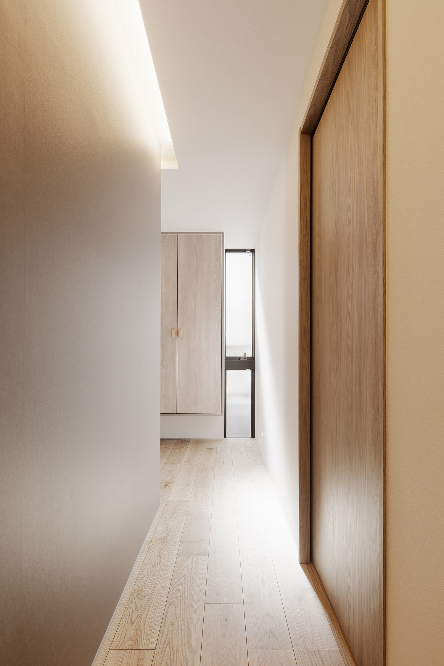 スリット窓から光が入る、壁際に間接照明を取り付けたおしゃれな廊下・デザイン住宅 注文住宅・デザイン住宅建築実例_『CASE766 ハコ/ラセン』_廊下